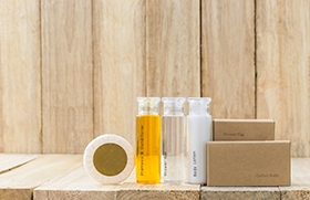 hotel toiletries on a woodbackground
