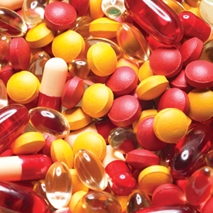 close up view of many different red and yellow pills