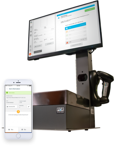 a cell phone in front a monitor 